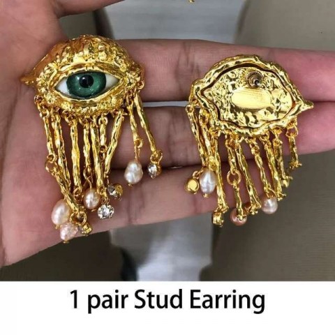 Women's Vintage Demon Eyes Exaggerated Clip-on Earrings with Imitated Pearl Tassels